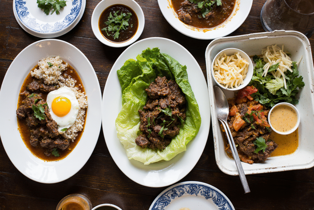Bowl of Korean beef over rice with colorful vegetable garnishes
